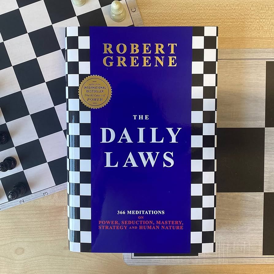 S97e4cd916c774914bf8919fb35450f5aj.jpg The Daily Laws: 366 Meditations On Power, Seduction, Mastery, Strategy, And Human Nature By Robert Greene - Image 1